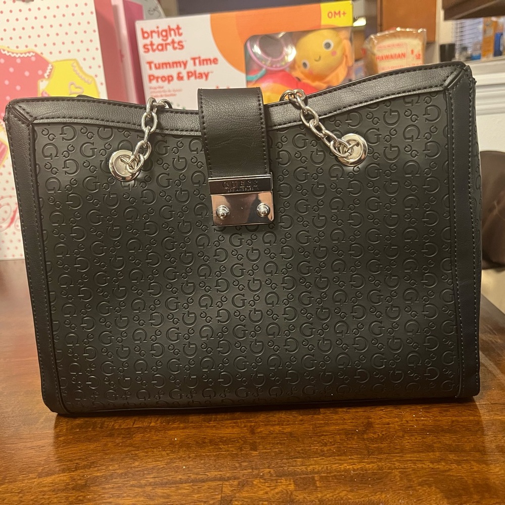 Guess purse with chain handles black gently used .